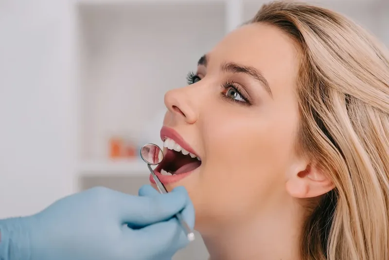 Patient smiling during a dental cleaning